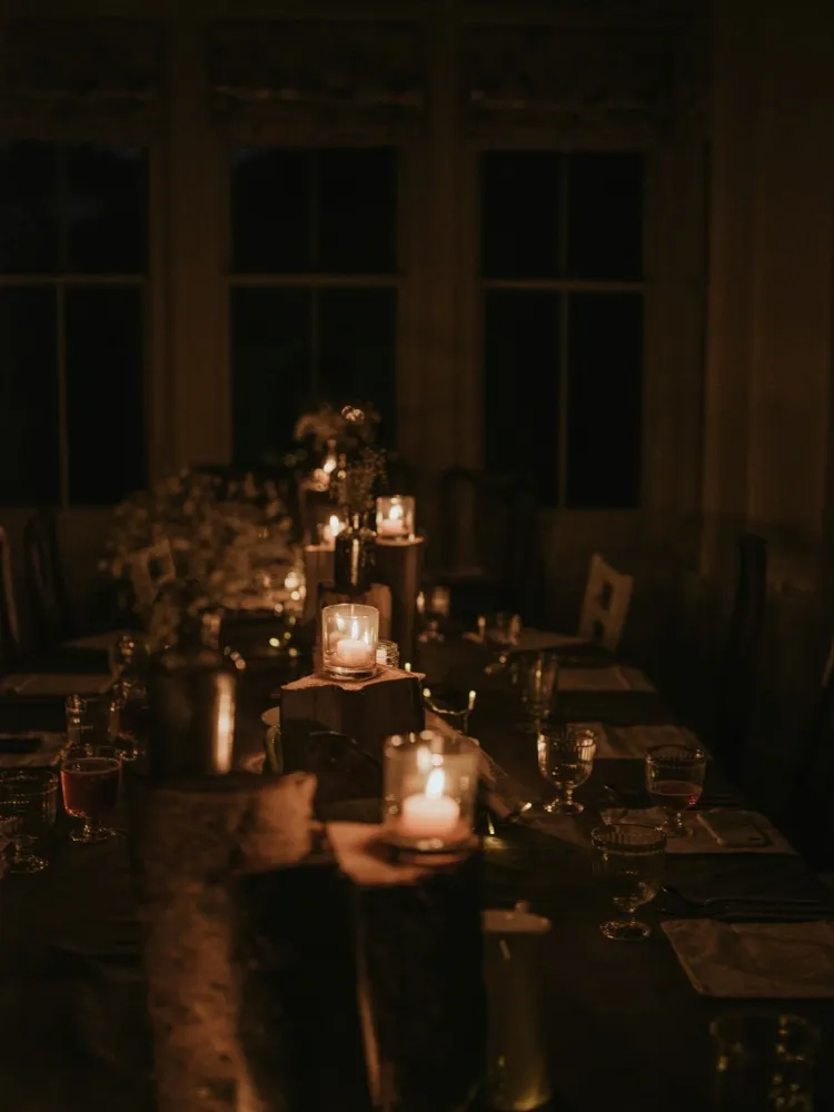 Candlelit table setting with glassware