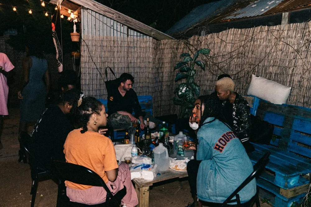 Outdoor gathering with string lights