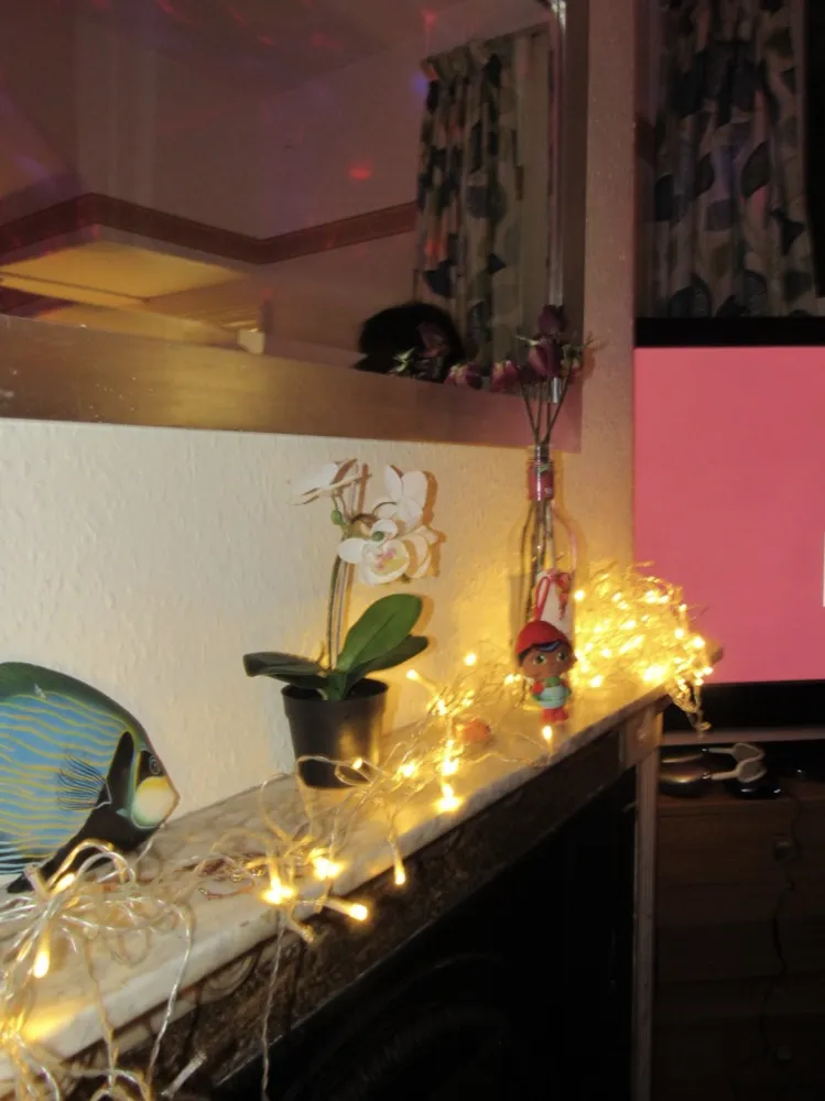 Fairy lights on a mantelpiece